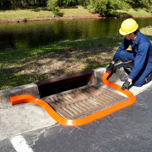 2100-Spill-Berm-Man-installing-around-drain.jpg